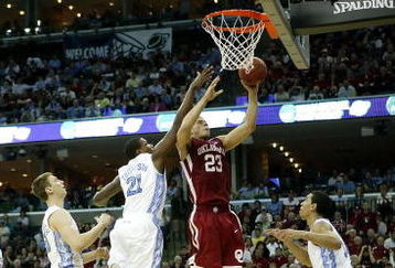 MEMPHIS, TN - MARCH 29:  Blake Griffin #23 of the Oklahoma Sooners goes up for a shot against Deon Thompson #21 and Danny Green #14 of the North Carolina Tar Heels during the NCAA Men's Basketball Tournament South Regional Final at the FedExForum on March 29, 2009 in Memphis, Tennessee. The Tar Heels defeated the Sooners 72-60 to advance to the Final Four.  (Photo by Joe Murphy/Getty Images)