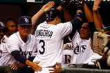 ST. PETERSBURG, FL - APRIL 14: Infielder Evan Longoria #3 of the Tampa Bay Rays is congratulated by his teammates after his seventh inning home run tied the game against the New York Yankees on April 14, 2008 at Tropicana Field in St. Petersburg, Florida. (Photo by J. Meric/Getty Images)