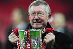 LONDON - MARCH 01:  Sir Alex Ferguson manager of Manchester United celebrates with the trophy after victory during the Carling Cup Final match between Manchester United and Tottenham Hotspur at Wembley Stadium on March 1, 2009 in London, England.  (Photo by Mike Hewitt/Getty Images)