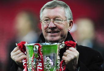 LONDON - MARCH 01:  Sir Alex Ferguson manager of Manchester United celebrates with the trophy after victory during the Carling Cup Final match between Manchester United and Tottenham Hotspur at Wembley Stadium on March 1, 2009 in London, England.  (Photo by Mike Hewitt/Getty Images)
