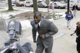 LEBANON - JANUARY 14: New York Giants wide receiver Plaxico Burress runs up the front steps toward members of the media as he arrives at the Lebanon County Courthouse January 14, 2009 in Lebanon, Pa.  Burress is scheduled to appear in a civil trial in a dispute with an automobile dealer over what he owes in damages to a vehicle supplied to him by the dealership. (Photo by Chris Gardner/Getty Images)