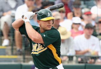TEMPE, AZ - MARCH 08:  Matt Holliday #5 of the Oakland Athletics bats against the Cleveland Indians during the spring training game at Phoenix Municipal Stadium on March 8, 2009 in Tempe, Arizona. The A's defeated the Indians 8-5.  (Photo by Christian Petersen/Getty Images)