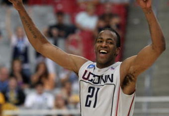 GLENDALE, AZ - MARCH 28:   Forward Stanley Robinson #21 of the Connecticut Huskies celebrates after winning the West Region by defeating the Missouri Tigers 82-75 in the Elite Eight of the NCAA Division I Men's Basketball Tournament at the University of Phoenix Stadium on March 28, 2009 in Glendale, Arizona.  (Photo by Ronald Martinez/Getty Images)