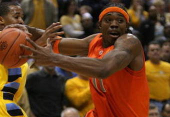 MILWAUKEE - MARCH 07: Paul Harris #11 of the Syracuse Orange tries to drive around Maurice Acker #2 of the Marquette Golden Eagles on March 7, 2009 at the Bradley Center in Milwaukee, Wisconsin. Syracuse defeated Marquette 86-79 in overtime.  (Photo by Jonathan Daniel/Getty Images)