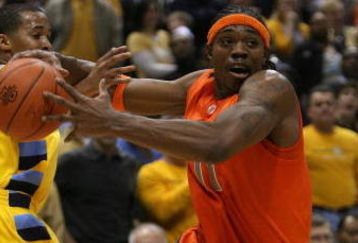 MILWAUKEE - MARCH 07: Paul Harris #11 of the Syracuse Orange tries to drive around Maurice Acker #2 of the Marquette Golden Eagles on March 7, 2009 at the Bradley Center in Milwaukee, Wisconsin. Syracuse defeated Marquette 86-79 in overtime.  (Photo by Jonathan Daniel/Getty Images)