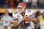 MIAMI - JANUARY 08:  Quarterback Tim Tebow #15 of the Florida Gators moves to pass the ball during the FedEx BCS National Championship Game against the Oklahoma Sooners at Dolphin Stadium on January 8, 2009 in Miami, Florida.  (Photo by Donald Miralle/Getty Images)