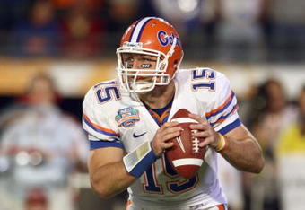 MIAMI - JANUARY 08:  Quarterback Tim Tebow #15 of the Florida Gators moves to pass the ball during the FedEx BCS National Championship Game against the Oklahoma Sooners at Dolphin Stadium on January 8, 2009 in Miami, Florida.  (Photo by Donald Miralle/Getty Images)