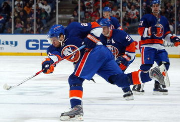 UNIONDALE, NY - MARCH 08:  Kyle Okposo #21 of the New York Islanders skates against the Phoenix Coyotes on March 8, 2009 at Nassau Coliseum in Uniondale, New York. The Isles defeated the Coyotes 3-2.  (Photo by Jim McIsaac/Getty Images)