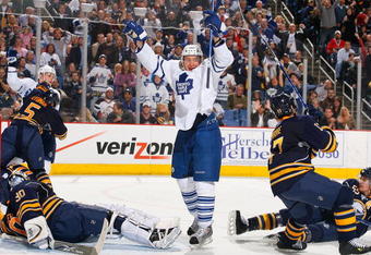 BUFFALO, NY - MARCH 27: Mikhail Grabovski #84 of the Toronto Maple Leafs celebrates Nikolai Kulemin's goal in the third period against the Buffalo Sabres on March 27, 2009 at HSBC Arena in Buffalo, New York.  (Photo by Rick Stewart/Getty Images)