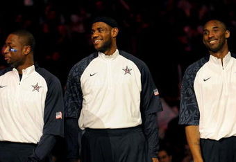 PHOENIX - FEBRUARY 15:  (L-R) Dwyane Wade, LeBron James and Kobe Bryant, members of the women's and men's gold medal winning USA Olympic basketball teams, wave to the crowd during half time of the 58th NBA All-Star Game, part of 2009 NBA All-Star Weekend at US Airways Center on February 15, 2009 in Phoenix, Arizona.  NOTE TO USER: User expressly acknowledges and agrees that, by downloading and or using this photograph, User is consenting to the terms and conditions of the Getty Images License Agreement.  (Photo by Ronald Martinez/Getty Images)