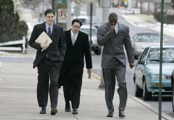 LEBANON - JANUARY 14: New York Giants wide receiver Plaxico Burress, right, walks with members of his legal team as he arrives at the Lebanon County Courthouse January 14, 2009 in Lebanon, Pa.  Burress is scheduled to appear in a civil trial in a dispute with an automobile dealer over what he owes in damages to a vehicle supplied to him by the dealership. (Photo by Chris Gardner/Getty Images)