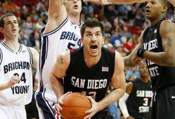 LAS VEGAS - MARCH 13:  Ryan Amoroso #43 of the San Diego State Aztecs pulls down a rebound in front of Chris Miles #54 of the Brigham Young University Cougars during a semifinal game of the Conoco Mountain West Conference Basketball Championships at the Thomas & Mack Center March 13, 2009 in Las Vegas, Nevada. the Aztecs won 64-62.  (Photo by Ethan Miller/Getty Images)