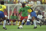 24 Jun 1994:  Roger Milla of Cameroon in action during the World Cup match against Brazil at the Stanford Stadium in San Francisco, California, USA. Brazil won the match 3-0. \ Mandatory Credit: David  Cannon/Allsport