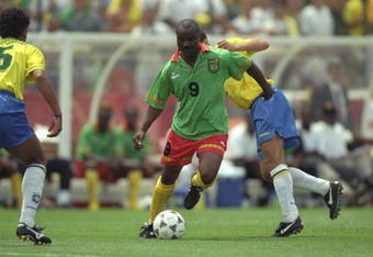 24 Jun 1994:  Roger Milla of Cameroon in action during the World Cup match against Brazil at the Stanford Stadium in San Francisco, California, USA. Brazil won the match 3-0. \ Mandatory Credit: David  Cannon/Allsport