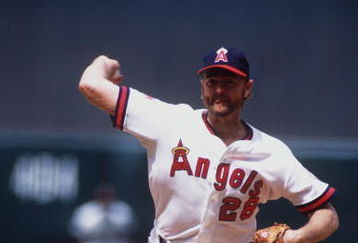 CALIFORNIA ANGELS PITCHER BERT BLYLEVEN WINDS UP TO PITCH DURING THE ANGELS GAME AT ANAHEIM STADIUM IN ANAHEIM, CALIFORNIA.