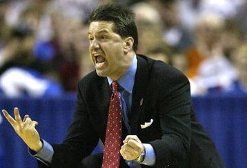 KANSAS CITY, MO - MARCH 21:  Head coach John Calipari of the Memphis Tigers encourages his players in the second half against the Oklahoma State Cowboys during the second round of the NCAA Division I Men's Basketball Tournament at Kemper Arena on March 21, 2004 in Kansas City, Missouri. The Oklahoma State Cowboys defeated the Memphis Tigers 70-53.  (Photo by Elsa/Getty Images)