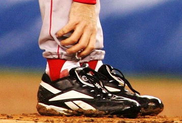 NEW YORK - OCTOBER 19:   Pitcher Curt Schilling #38 of the Boston Red Sox grabs at his ankle as it appears to be bleeding in the fourth inning during game six of the American League Championship Series against the New York Yankees on October 19, 2004 at Yankee Stadium in the Bronx borough of New York City. (Photo by Al Bello/Getty Images)