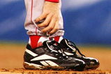 NEW YORK - OCTOBER 19:   Pitcher Curt Schilling #38 of the Boston Red Sox grabs at his ankle as it appears to be bleeding in the fourth inning during game six of the American League Championship Series against the New York Yankees on October 19, 2004 at Yankee Stadium in the Bronx borough of New York City. (Photo by Al Bello/Getty Images)