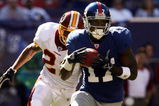 EAST RUTHERFORD, NJ - OCTOBER 08:  Plaxico Burress #17 of the New York Giants runs for a 46-yard gain in front of Sean Taylor #21 of the Washington Redskins on October 8, 2006 at Giants Stadium in East Rutherford, New Jersey.  (Photo by Nick Laham/Getty Images)