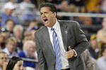 GLENDALE, AZ - MARCH 26:  Head Coach John Calipari of the Memphis Tigers adjusts his team against the Missouri Tigers in the Sweet 16 of the NCAA Division I Men's Basketball Tournament at the University of Phoenix Stadium on March 26, 2009 in Glendale, Arizona.  (Photo by Ronald Martinez/Getty Images)