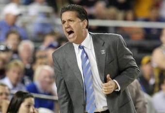 GLENDALE, AZ - MARCH 26:  Head Coach John Calipari of the Memphis Tigers adjusts his team against the Missouri Tigers in the Sweet 16 of the NCAA Division I Men's Basketball Tournament at the University of Phoenix Stadium on March 26, 2009 in Glendale, Arizona.  (Photo by Ronald Martinez/Getty Images)