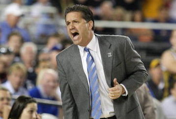 GLENDALE, AZ - MARCH 26:  Head Coach John Calipari of the Memphis Tigers adjusts his team against the Missouri Tigers in the Sweet 16 of the NCAA Division I Men's Basketball Tournament at the University of Phoenix Stadium on March 26, 2009 in Glendale, Arizona.  (Photo by Ronald Martinez/Getty Images)