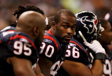 NEW ORLEANS - AUGUST 16:  Defensive end Mario Williams #90 of the Houston Texans rests on the bench while taking on the New Orleans Saints during a pre-season game at Louisiana Superdome on August 16, 2008 in New Orleans Louisiana.  (Photo by Doug Benc/Getty Images)
