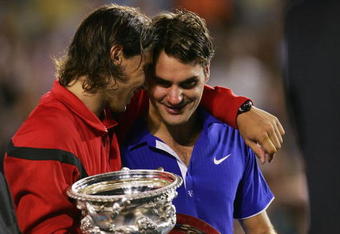 MELBOURNE, AUSTRALIA - FEBRUARY 01:  Rafael Nadal of Spain consoles Roger Federer of Switzerland during the trophy presentation after his men's final match during day fourteen of the 2009 Australian Open at Melbourne Park on  February 1, 2009 in Melbourne, Australia.  (Photo by Scott Barbour/Getty Images)