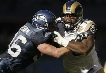 SEATTLE - OCTOBER 10:  Defensive end Grant Wistrom #96 of the Seattle Seahawks blocks tackle Orlando Pace #76 of the St. Louis Rams during the game at Qwest Field on October 10, 2004 in Seattle, Washington. The Rams defeated the Seahawks 33-27 in overtime. (Photo by Otto Greule Jr/Getty Images)