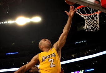 LOS ANGELES - MARCH 17:   Derek Fisher #2 of  the Los Angeles Lakers shoots against the Philadelphia 76ers on March 17, 2009 at Staples Center in Los Angeles, California. The 76ers won 94-93.   NOTE TO USER: User expressly acknowledges and agrees that, by downloading and/or using this Photograph, user is consenting to the terms and conditions of the Getty Images License Agreement. (Photo by Stephen Dunn/Getty Images)