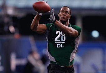 INDIANAPOLIS, IN - FEBRUARY 23:  Defensive lineman Mike Johnson of Georgia Tech catches the football during the NFL Scouting Combine presented by Under Armour at Lucas Oil Stadium on February 23, 2009 in Indianapolis, Indiana. (Photo by Scott Boehm/Getty Images)