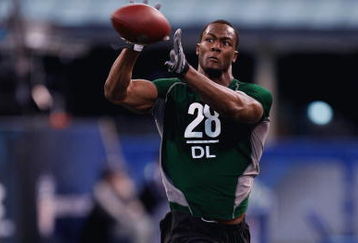 INDIANAPOLIS, IN - FEBRUARY 23:  Defensive lineman Mike Johnson of Georgia Tech catches the football during the NFL Scouting Combine presented by Under Armour at Lucas Oil Stadium on February 23, 2009 in Indianapolis, Indiana. (Photo by Scott Boehm/Getty Images)