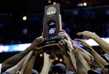 MEMPHIS, TN - MARCH 29:  The North Carolina Tar Heels hold up the South Regional trophy after defeating the Oklahoma Sooners during the NCAA Men's Basketball Tournament South Regional Final at the FedExForum on March 29, 2009 in Memphis, Tennessee. The Tar Heels defeated the Sooners 72-60 to advance to the Final Four.  (Photo by Joe Murphy/Getty Images)