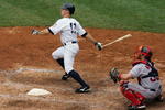 NEW YORK - JULY 05:  Brett Gardner #11 of the New York Yankees hits a run scoring sacfrifice fly in the sixth inning against the Boston Red Sox on July 5, 2008 at Yankee Stadium in the Bronx borough of New York City. The Yankees won the game 2-1.  (Photo by Jim McIsaac/Getty Images)