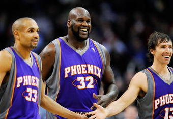 LOS ANGELES, CA - FEBRUARY 18:  Shaquille O'Neal #32 of the Phoenix Suns is congratualted by his teammate Steve Nash #13 and Grant Hill #33 during the basketball game against the Los Angeles Clippers during the second quarter at the Staples Center on February 18, 2009 in Los Angeles, California. NOTE TO USER: User expressly acknowledges and agrees that, by downloading and or using this photograph, User is consenting to the terms and conditions of the Getty Images License Agreement.  (Photo by Kevork Djansezian/Getty Images)