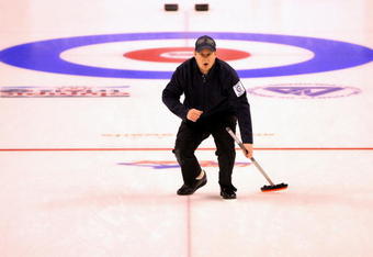 BROONFIELD, CO - FEBRUARY 28:  Skip John Shuster directs his teammates after delivering a stone against Team Tyler George during the Men's US Curling Olympic Trials Finals at the Broomfield Event Center on February 28, 2009 in Broomfield, Colorado.  (Photo by Doug Pensinger/Getty Images)