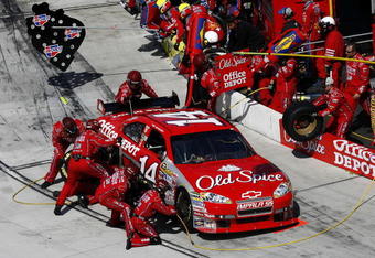 MARTINSVILLE, VA - MARCH 29:  Tony Stewart driver of the #14 Old Spice/Home Depot Chevrolet makes a pit stop during the NASCAR Sprint Cup Series Goody's Fast Pain Relief 500 at the Martinsville Speedway on March 29, 2009 in Martinsville, Virginia.  (Photo by John Harrelson/Getty Images)