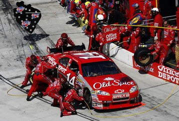 MARTINSVILLE, VA - MARCH 29:  Tony Stewart driver of the #14 Old Spice/Home Depot Chevrolet makes a pit stop during the NASCAR Sprint Cup Series Goody's Fast Pain Relief 500 at the Martinsville Speedway on March 29, 2009 in Martinsville, Virginia.  (Photo by John Harrelson/Getty Images)