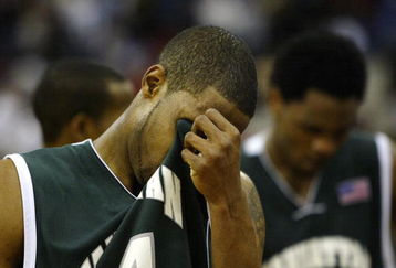 RALEIGH, NC - MARCH 20:  Peter Mulligan #44 of the Manhattan Jaspers walks off the court after a 84-80 defeat during the second round game of the NCAA Division I Men's Basketball Tournament to the Wake Forest Demon Deacons at RBC Center on March 20, 2004 in Raleigh, North Carolina.  (Photo by Ezra Shaw/Getty Images)