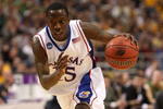 MINNEAPOLIS - MARCH 20:  Tyshawn Taylor #15 of the Kansas Jayhawks drives against the North Dakota State Bison during the first round of the NCAA Division I Men's Basketball Tournament at the Hubert H. Humphrey Metrodome on March 20, 2009 in Minneapolis, Minnesota. Kansas won 84-74. (Photo by Jonathan Daniel/Getty Images)