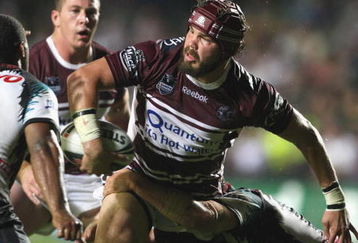SYDNEY, AUSTRALIA - MARCH 30:  Adam Cuthbertson  of the Sea Eagles gets a pass away as he is tackled during the round three NRL match between the Manly Warringah Sea Eagles and the Penrith Panthers at Brookvale Oval on March 30, 2009 in Sydney, Australia.  (Photo by Mark Kolbe/Getty Images)