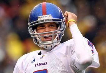 KANSAS CITY, MO - NOVEMBER 29:  Quarterback Todd Reesing #5 of the Kansas Jayhawks celebrates after  a touchdown during the first half of the game against the Missouri Tigers on November 29, 2008 at Arrowhead Stadium in Kansas City, Missouri.  (Photo by Jamie Squire/Getty Images)