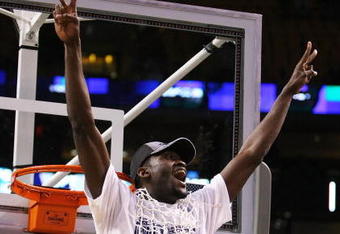 BOSTON - MARCH 28:  Shane Clark #20 of the Villanova Wildcats cuts down the net after defeating the Pittsburgh Panthers during the NCAA Men's Basketball Tournament East Regionals at TD Banknorth Garden on March 28, 2009 in Boston, Massachusetts.  (Photo by Elsa/Getty Images)