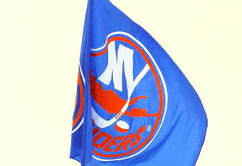UNIONDALE, NY - NOVEMBER 29:  A New York Islanders ice girl skates with a flag after the game against the Ottawa Senators on November 29, 2008 at Nassau Coliseum in Uniondale, New York. The Isles defeated the Senators 4-2.  (Photo by Jim McIsaac/Getty Images)