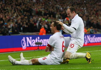LONDON - APRIL 01:  John Terry of England celebrates scoring his goal with Wayne Rooney during the FIFA 2010 World Cup Group 6 Qualifying match between England and Ukraine at Wembley Stadium on April 1, 2009 in London, England.  (Photo by Ryan Pierse/Getty Images)