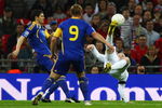 LONDON - APRIL 01: Wayne Rooney of England makes a spectacular attempt at goal during the FIFA 2010 World Cup Group 6 Qualifying match between England and Ukraine at Wembley Stadium on April 1, 2009 in London, England.  (Photo by Ryan Pierse/Getty Images)