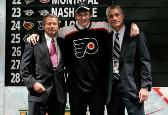 COLUMBUS, OH - JUNE 22:  Second overall pick James vanRiemsdyk of the Philadelphia Flyers poses with team General Manager Paul Holmgren,right, along with another member of team personnel onstage after being drafted in the first round of the 2007 NHL Entry Draft at Nationwide Arena on June 22, 2007 in Columbus, Ohio.  (Photo by Bruce Bennett/Getty Images)