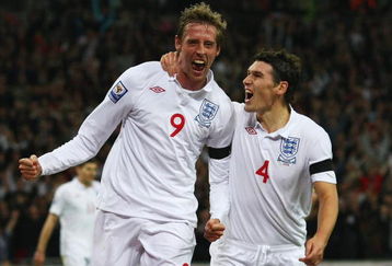 LONDON - APRIL 01:  Peter Crouch of England celebrates with Gareth Barry (R) as he scores their first goal during the FIFA 2010 World Cup Group 6 Qualifying match between England and Ukraine at Wembley Stadium on April 1, 2009 in London, England.  (Photo by Clive Rose/Getty Images)
