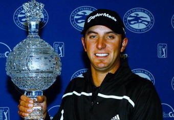 PEBBLE BEACH, CA - FEBRUARY 16:  Dustin Johnson poses with the trophy after being declared the winner of the AT&T Pebble Beach National Pro-Am at the Pebble Beach Golf Links on February 16, 2009 in Pebble Beach, California.  (Photo by Jeff Gross/Getty Images)