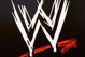 NEW YORK - MARCH 18:  The World Wrestling Entertainment logo hangs on a wall at a media conference announcing the all-star lineup of WWE WrestleMania XIX at ESPN Zone in Times Square March 18, 2003 in New York City.  (Photo by Mark Mainz/Getty Images)